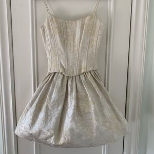 Corset top, tutu skirt, mini dress.